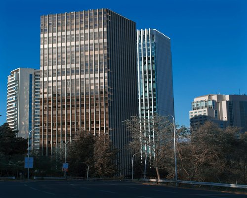 A modern office building facade with glass windows located in Providencia Santiago Chile on a sunny day